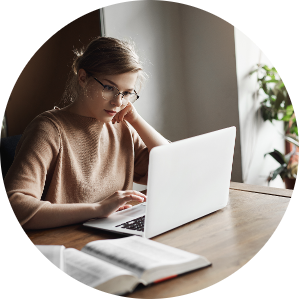 cute european female coworker glasses sitting near window cafe leaning head hand reading articles network via laptop searching information work making