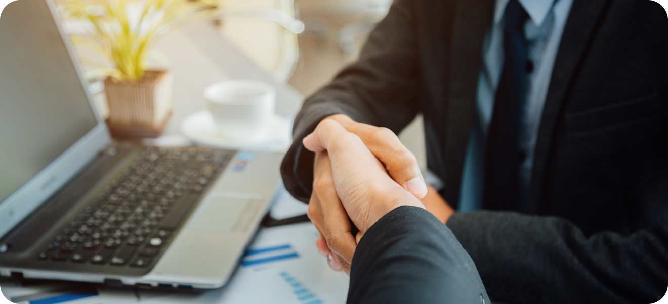 directly shot business people shaking hands documents office