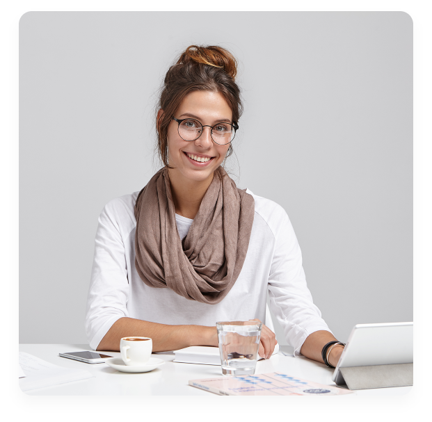 young brunette woman sitting desk